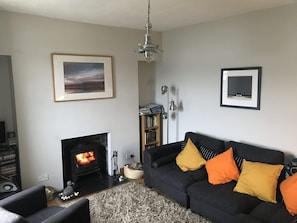 Cottage living room and log stove