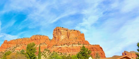 View of our home, front yard, garage & red rocks behind our home