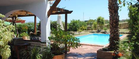 View of terrace and pool from entrance
