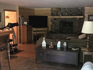 living area with fire place, wood sold at a nominal fee.