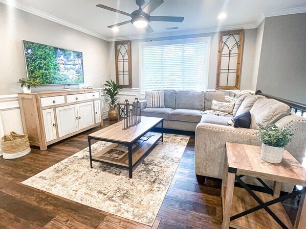 Living Room With Comfy Sectional Makes for the Perfect Place to Watch a Movie.
