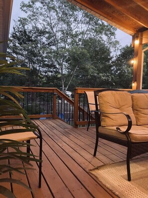Enjoy Our Covered Porch Area in the Backyard.