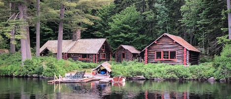 Dock, Main Cabin  on left, Bath House in center, Guest Cabin on right.