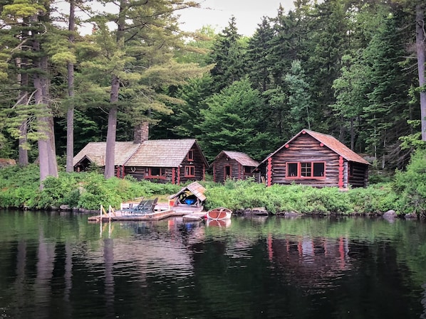 Dock, Main Cabin  on left, Bath House in center, Guest Cabin on right.