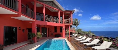 Rear of villa, pool deck, salt-sanitized pool over Marigot Bay & Caribbean Sea