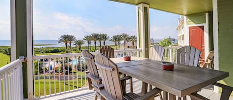 Outside seating looks toward the pool area and Galveston Bay.