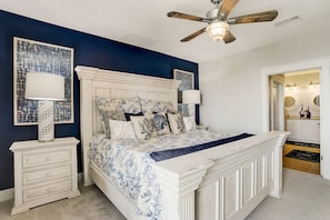 Master bedroom has a king size bed, private bath and balcony access.