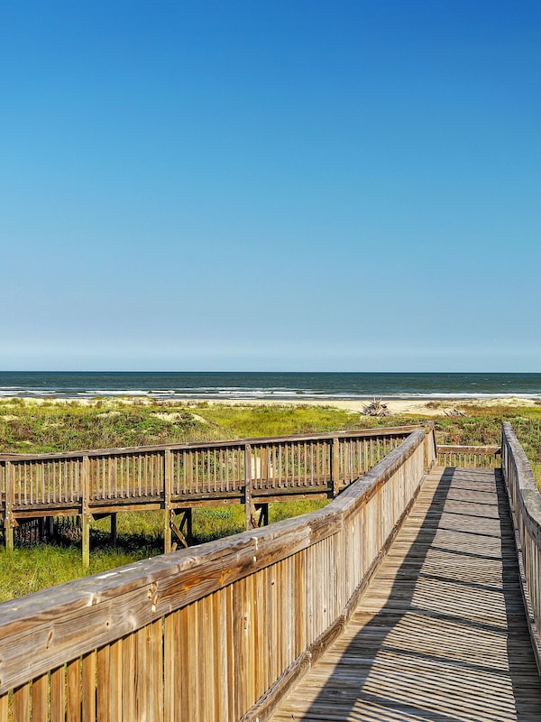 There are several walkways over the protected sand dunes to take you to beach.