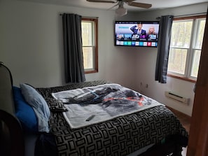 king bed with heating pad and tv
