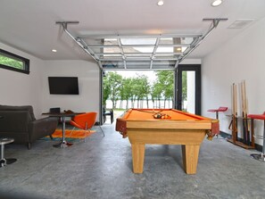 Large glass overhead door opens to the Lake for breezy spring and fall days!