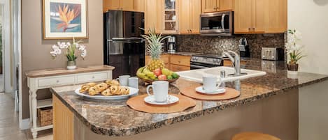 Regency 620 Gorgeous Granite Countertops and Honey Colored Cabinetry