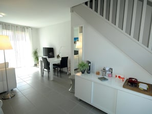 Enjoy the cozy and open-concept living space, perfect for relaxing after a great day.