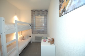 The sleeping area features a Bunk bed.