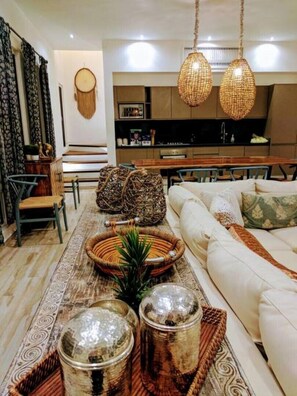 Living/dining area, full kitchen with Italian custom cabinetry, granite counters