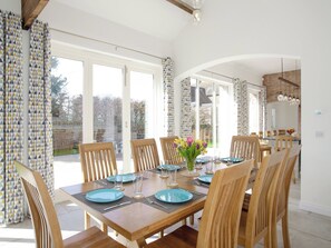 Stylish dining area with views over the garden | The Cartshed, Slindon, near Eccleshall