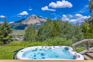 Large salt water hot tub sits 8.