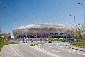 A photo of a Tauron Arena nearby, providing a sense of the surrounding neighborhood.