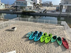 8 kayaks (2 are double), a fire pit, water views, and a fully fenced in yard