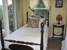 single bed in attached sunroom