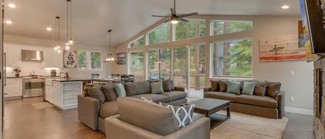 Living area with contemporary furniture, flat screen tv, and fireplace