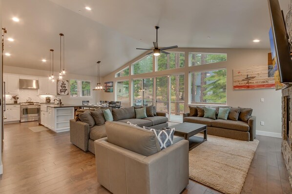 Living area with contemporary furniture, flat screen tv, and fireplace