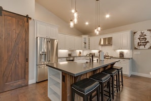 Kitchen area with stainless-steel appliances and spacious island