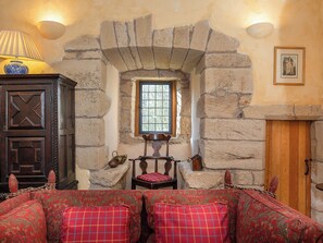 Wonderful living room with exposed stonework | Braidwood Castle - Braidwood Castle, Braidwood, near Carluke