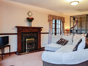 Spacious living area with imposing fireplace | Hazelmere, Rattray, near Blairgowrie