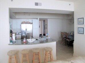 Kitchen, counter, and dining area 