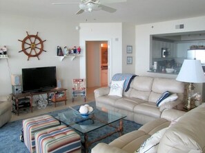 Living area, door to master suite, counter in kitchen,  Overlooks balcony & gulf