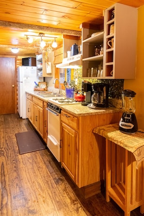 Kitchen includes Keurig and drip coffee machines, dishes, utensils and cookware