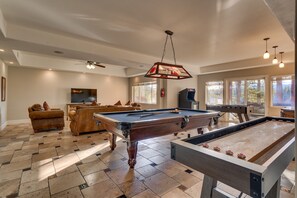 Living area with arcade, pool table and shuffle board