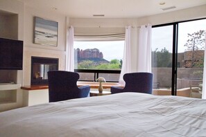 Huge master bedroom with Cal King bed, fire place, TV, and views 