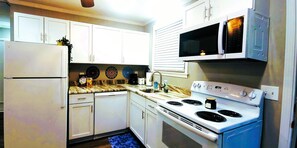 Beautiful new kitchen cabinets, counters and added Microwave oven and dishwasher