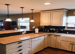 Kitchen view-- modern kitchen with counter and bar stools