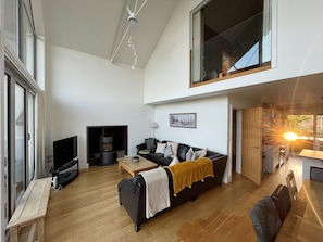 Living room with wood burner | Muntjac Lodge, Somerford Keynes, near Cirencester