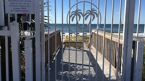 Private beach through secured gate.