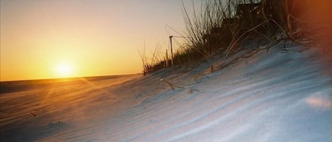 White soft cool sands under your feet and the sun on your face, just steps away.