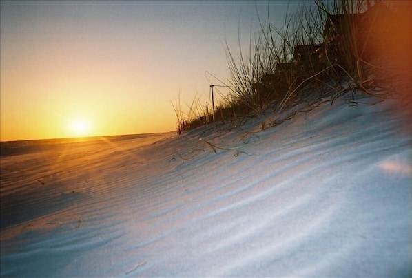 White soft cool sands under your feet and the sun on your face, just steps away.