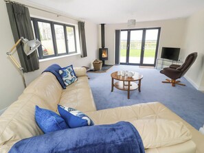 Comfortable living room with wood burner | Woodland View, Wigginton, near Tamworth