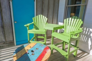 These high top Adirondack chairs & table are the perfect spot for your morning coffee.