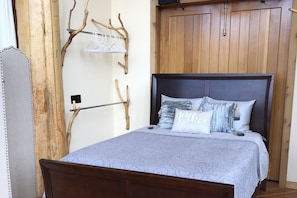 See the stars at night! Queen bed with privacy screen situated on the main floor