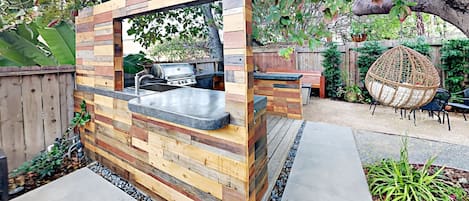 Shared Backyard with Brand New Jacuzzi Outdoor Kitchen with Built in BBQ, Fire pit, shared laundry, private deck.