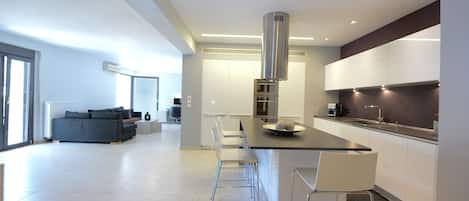 View from the entrance of the apartment with the kitchen and the living room