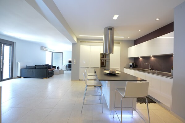 View from the entrance of the apartment with the kitchen and the living room