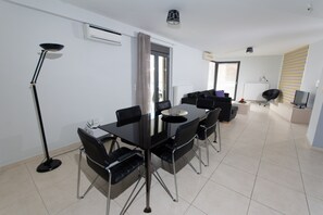 View of dining table and relaxing living room 