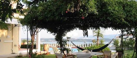 The central patio of the garden with outstanding view to Porto Heli & Spetses