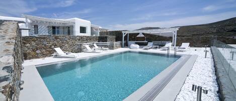 Panoramic view of the house , pool area , bbq & daytime lounge area