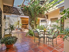 The patio is a refreshing spot for morning coffee while checking in with friends