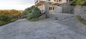 Private road of the whole estate and private entrance of the house with a gate